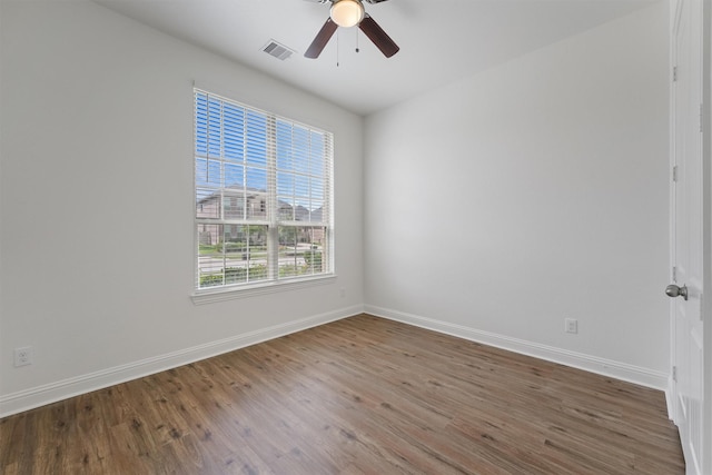 10091 Black Maple Dr, Conroe, TX 77385 - empty room with wood finished floors, baseboards, and a ceiling fan