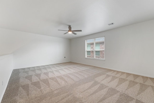 10091 Black Maple Dr, Conroe, TX 77385 - empty room with a ceiling fan, light carpet, and baseboards