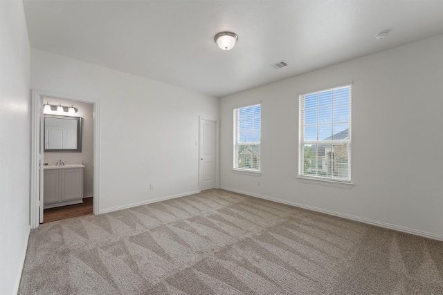 10091 Black Maple Dr, Conroe, TX 77385 - unfurnished bedroom with carpet floors, baseboards, and ensuite bathroom