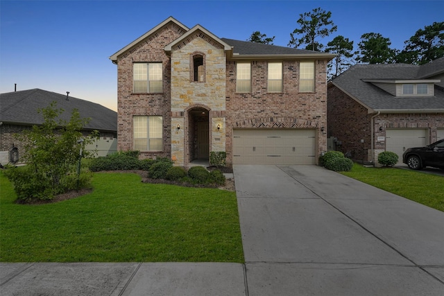 10091 Black Maple Dr, Conroe, TX 77385 - french provincial home featuring brick siding, an attached garage, concrete driveway, and a lawn