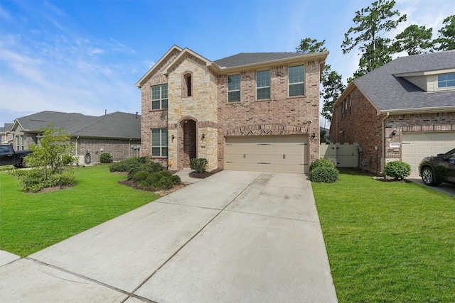 10091 Black Maple Dr, Conroe, TX 77385 - view of front of home featuring brick siding, an attached garage, concrete driveway, and a front yard