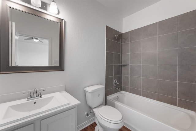10091 Black Maple Dr, Conroe, TX 77385 - full bathroom featuring toilet, vanity, washtub / shower combination, a ceiling fan, and wood finished floors