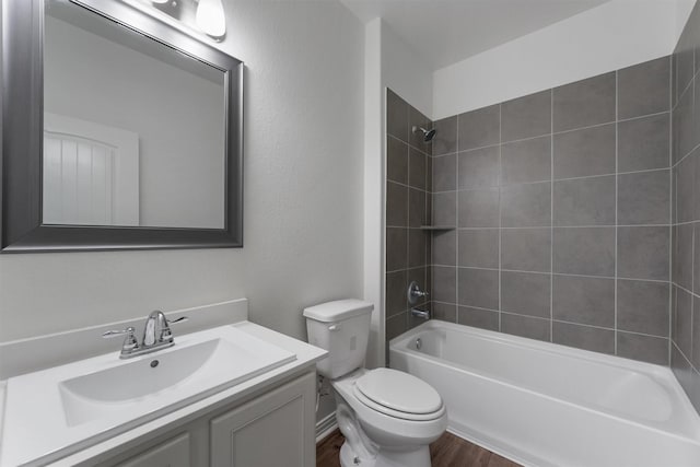 10091 Black Maple Dr, Conroe, TX 77385 - bathroom featuring toilet, vanity, tub / shower combination, and wood finished floors