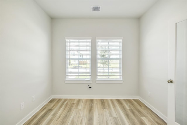 1203 Wildflower Way Dr, Beasley, TX 77417 - spare room featuring light wood-type flooring and baseboards