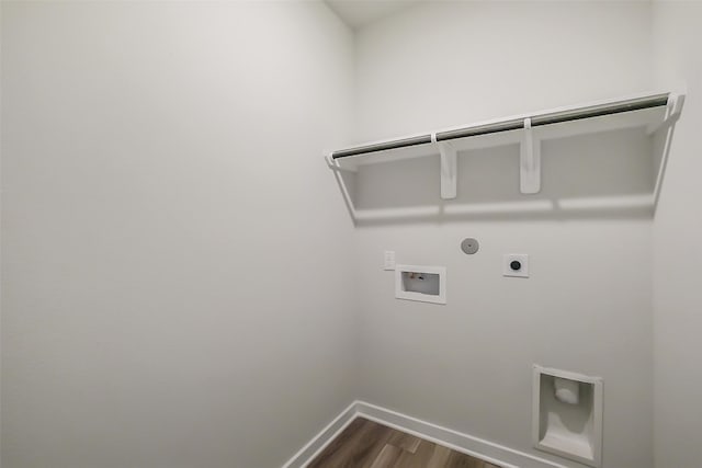 1203 Wildflower Way Dr, Beasley, TX 77417 - washroom with electric dryer hookup, hookup for a washing machine, gas dryer hookup, and dark wood-type flooring