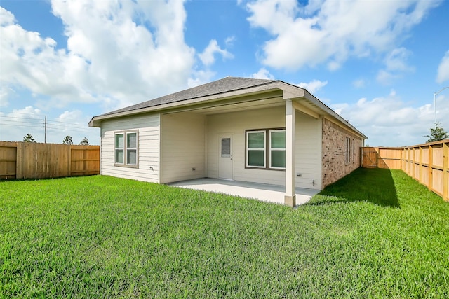 1203 Wildflower Way Dr, Beasley, TX 77417 - rear view of property with a fenced backyard, a patio area, and brick siding