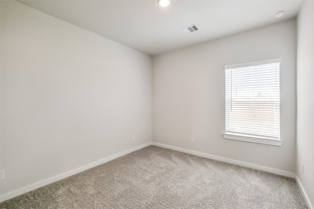 1203 Wildflower Way Dr, Beasley, TX 77417 - spare room featuring light carpet and a smoke detector