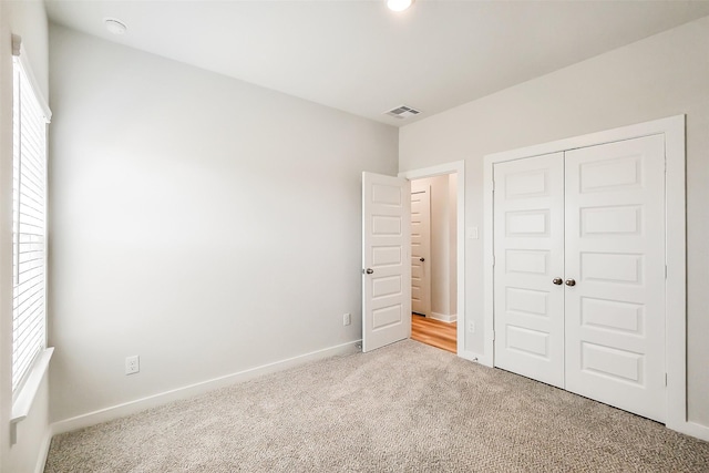 1203 Wildflower Way Dr, Beasley, TX 77417 - unfurnished bedroom featuring carpet flooring and a closet