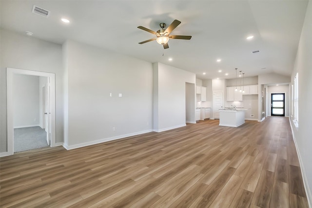 1203 Wildflower Way Dr, Beasley, TX 77417 - unfurnished living room with ceiling fan, light wood-style flooring, and recessed lighting
