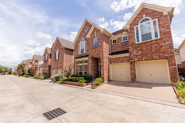 3531 Urban Woods Trl, Houston, TX 77008 - view of front facade with brick siding, driveway, a garage, and a residential view