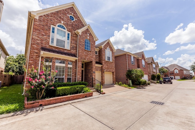 3531 Urban Woods Trl, Houston, TX 77008 - view of front of property featuring brick siding, concrete driveway, a garage, and a residential view