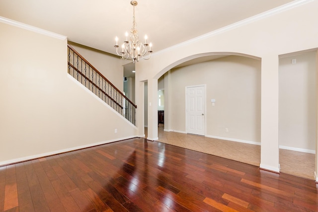 3531 Urban Woods Trl, Houston, TX 77008 - empty room with hardwood / wood-style floors, a chandelier, crown molding, arched walkways, and stairway