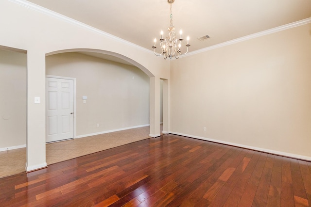 3531 Urban Woods Trl, Houston, TX 77008 - empty room featuring wood-type flooring, arched walkways, a chandelier, and crown molding