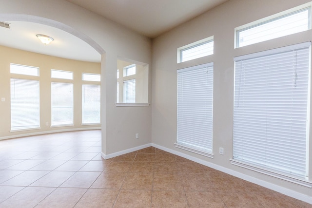 3531 Urban Woods Trl, Houston, TX 77008 - empty room with arched walkways and light tile patterned flooring