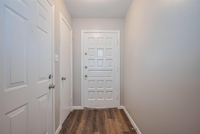 9003 Chateau Forest Dr, Houston, TX 77088 - entryway featuring dark wood-type flooring and baseboards