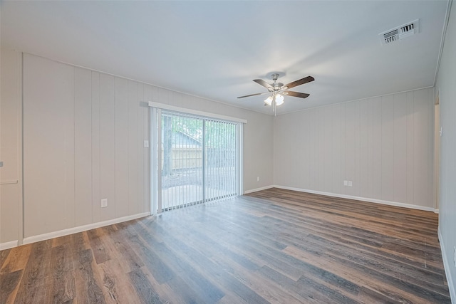 9003 Chateau Forest Dr, Houston, TX 77088 - unfurnished room featuring a ceiling fan, wood finished floors, and baseboards