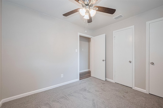 9003 Chateau Forest Dr, Houston, TX 77088 - unfurnished bedroom with carpet flooring, baseboards, and ceiling fan