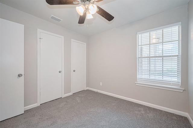 9003 Chateau Forest Dr, Houston, TX 77088 - unfurnished bedroom featuring carpet, baseboards, and a ceiling fan