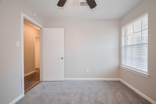 9003 Chateau Forest Dr, Houston, TX 77088 - empty room with carpet floors, ceiling fan, a smoke detector, and baseboards