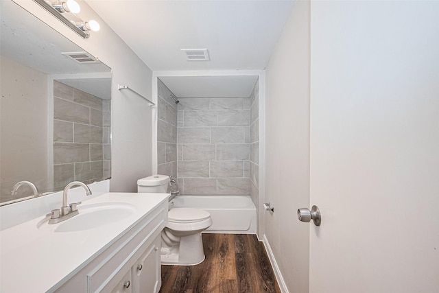 9003 Chateau Forest Dr, Houston, TX 77088 - full bath with wood finished floors, toilet, vanity, bathtub / shower combination, and baseboards