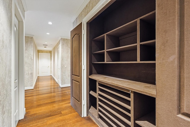 1000 Uptown Park Blvd Unit 181, Houston, TX 77056 - hallway with wood finished floors, ornamental molding, baseboards, and recessed lighting