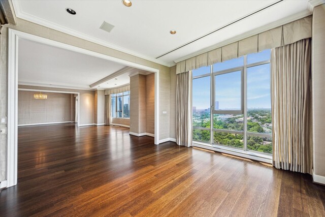 1000 Uptown Park Blvd Unit 181, Houston, TX 77056 - spare room featuring crown molding, wood finished floors, and baseboards