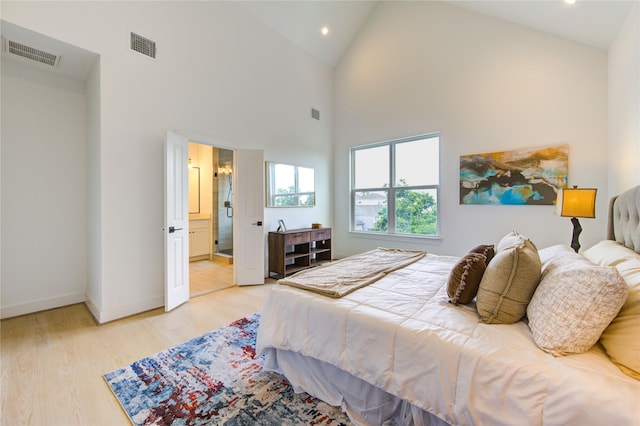 2310 Reinerman St, Houston, TX 77007 - bedroom with light wood finished floors, recessed lighting, high vaulted ceiling, and baseboards