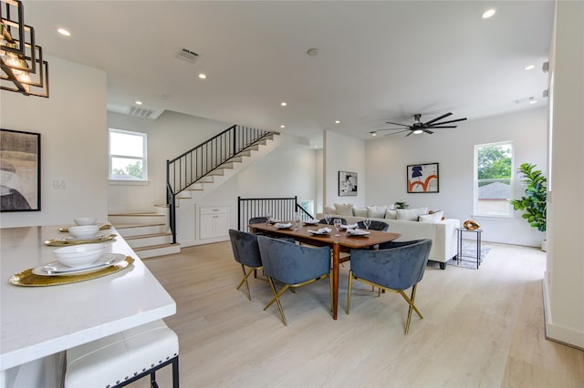 2310 Reinerman St, Houston, TX 77007 - dining space featuring light wood-style floors, healthy amount of natural light, ceiling fan, stairway, and recessed lighting