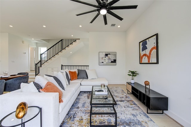 2310 Reinerman St, Houston, TX 77007 - living room with ceiling fan, stairs, recessed lighting, baseboards, and light wood-type flooring