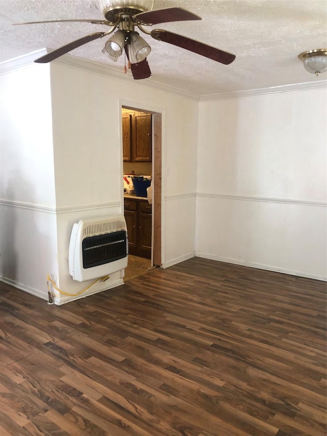 409 7th St, Huntsville, TX 77320 - unfurnished living room featuring heating unit, a ceiling fan, dark wood-style floors, a textured ceiling, and ornamental molding