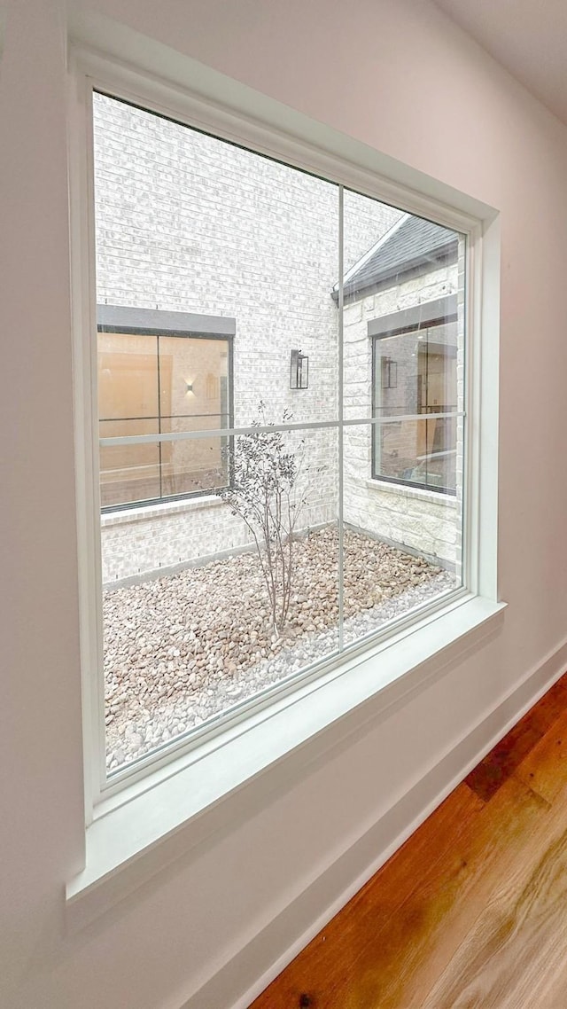 4785 W Fork Blvd, Conroe, TX 77304 - detailed view of wood finished floors and baseboards