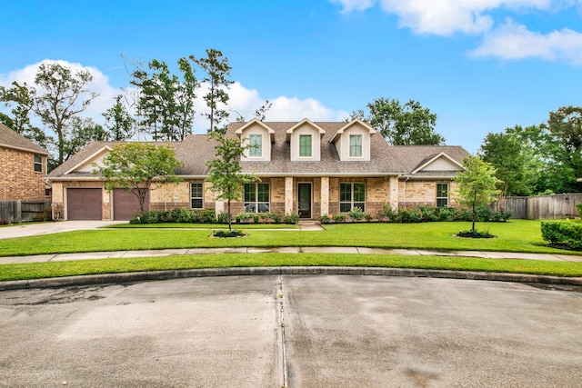 12406 Fort Isabella Ct, Tomball, TX 77375 - view of front of house featuring a garage, driveway, stone siding, and a shingled roof