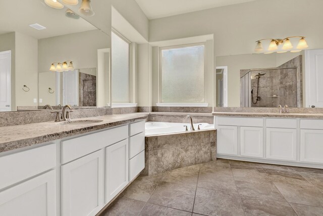12406 Fort Isabella Ct, Tomball, TX 77375 - bathroom featuring a stall shower, two vanities, and a bath