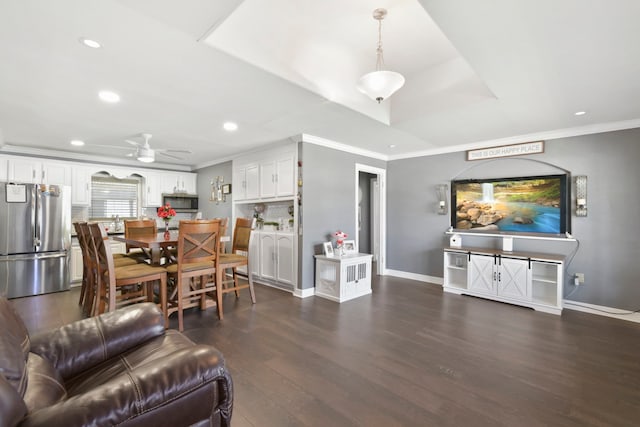 1900 Oregon St, Baytown, TX 77520 - living area featuring crown molding, dark wood-type flooring, baseboards, recessed lighting, and ceiling fan