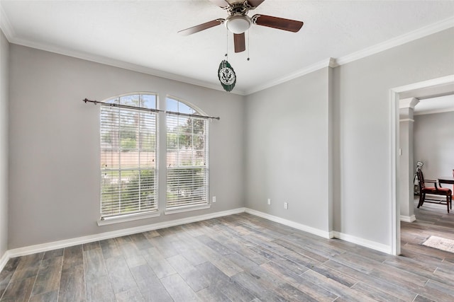 2907 Silverberry Trl, Houston, TX 77345 - spare room featuring crown molding, wood finished floors, baseboards, and a ceiling fan