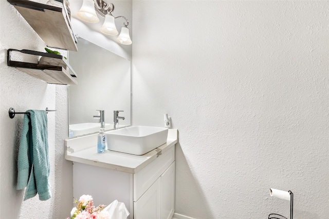 2907 Silverberry Trl, Houston, TX 77345 - bathroom with vanity and a textured wall