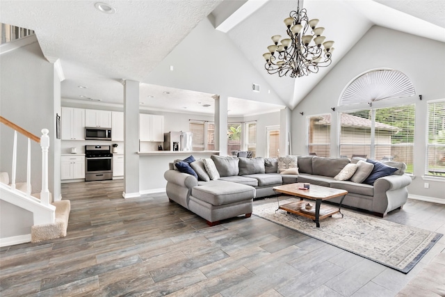 2907 Silverberry Trl, Houston, TX 77345 - living room with high vaulted ceiling, healthy amount of natural light, wood finished floors, stairway, and baseboards