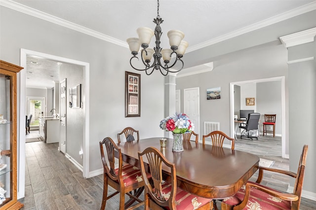 2907 Silverberry Trl, Houston, TX 77345 - dining area with baseboards, ornamental molding, a chandelier, wood finished floors, and a desk