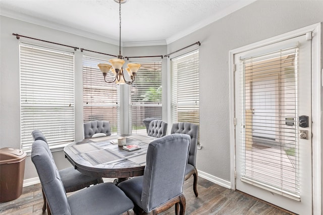 2907 Silverberry Trl, Houston, TX 77345 - dining area with a chandelier, wood finished floors, ornamental molding, and baseboards