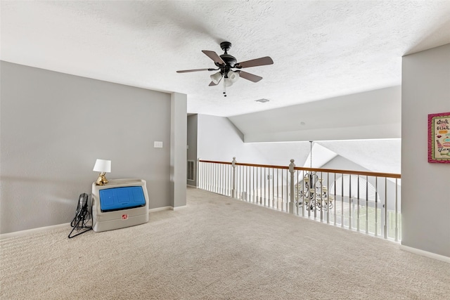 2907 Silverberry Trl, Houston, TX 77345 - additional living space featuring ceiling fan, carpet floors, baseboards, a textured ceiling, and lofted ceiling