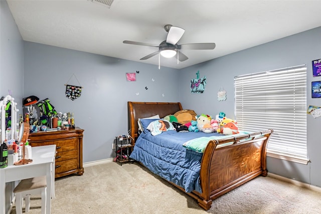 2907 Silverberry Trl, Houston, TX 77345 - carpeted bedroom with baseboards and ceiling fan