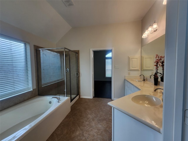 13705 Rainwater Dr, Pearland, TX 77584 - bathroom with double vanity, plenty of natural light, a bath, lofted ceiling, and a shower stall