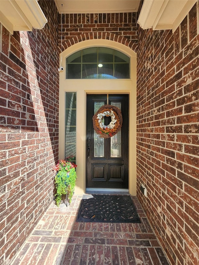 13705 Rainwater Dr, Pearland, TX 77584 - view of exterior entry featuring brick siding