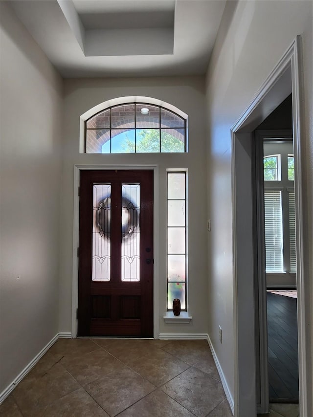 13705 Rainwater Dr, Pearland, TX 77584 - entrance foyer with plenty of natural light, baseboards, and a raised ceiling
