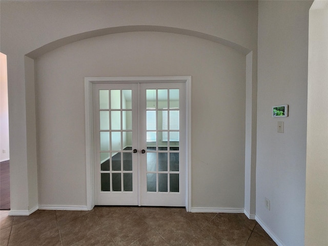 13705 Rainwater Dr, Pearland, TX 77584 - doorway with french doors, baseboards, and tile patterned flooring