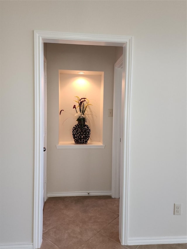 13705 Rainwater Dr, Pearland, TX 77584 - corridor featuring tile patterned flooring and baseboards