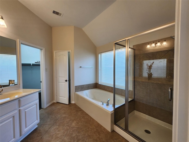 13705 Rainwater Dr, Pearland, TX 77584 - bathroom with a stall shower, vanity, a bath, lofted ceiling, and baseboards