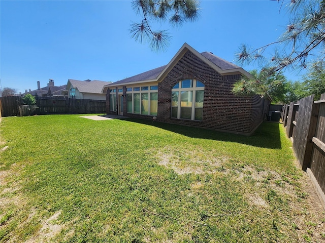 13705 Rainwater Dr, Pearland, TX 77584 - rear view of property featuring brick siding