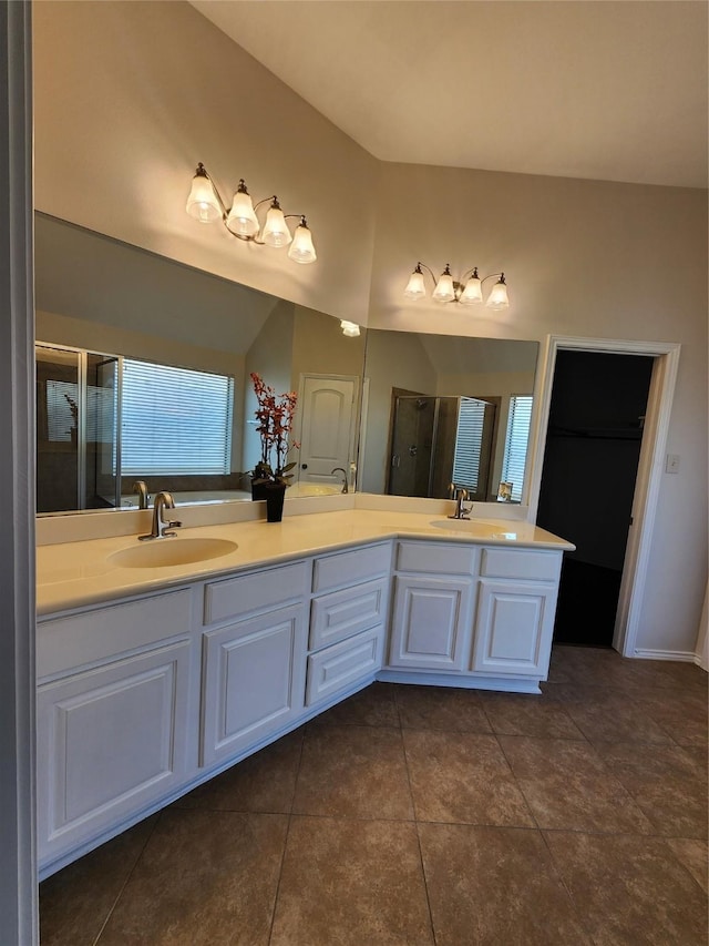 13705 Rainwater Dr, Pearland, TX 77584 - bathroom with double vanity, tile patterned floors, and a stall shower