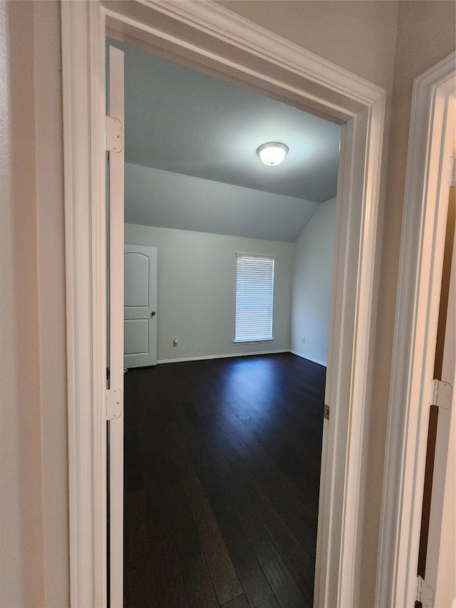 13705 Rainwater Dr, Pearland, TX 77584 - hall featuring dark wood-style flooring, lofted ceiling, and baseboards